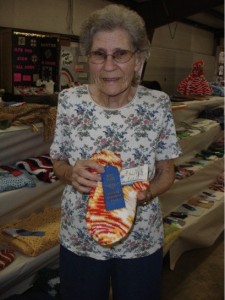 Lillie Burdine with her knitting at the Boone County Fair, photo by her granddaughter, student Lacey Vanderpool.